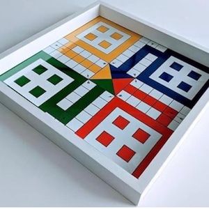 The Ludo board game, which measures 50 x 50 cm and has a glass top, is a classic board game enjoyed by all ages.