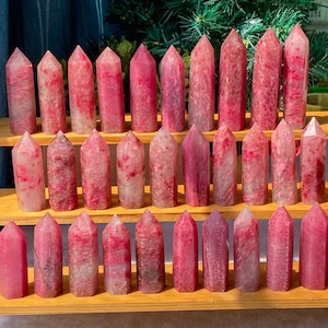 May include: A set of three ceramic mugs with a speckled, matte finish. The mugs are in shades of cream, light gray, and dark gray. Each mug has a simple, minimalist design, perfect for coffee or tea.