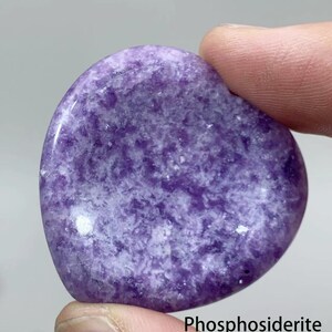 May include: A purple and white heart-shaped polished stone with the text "Phosphosiderite" below it.