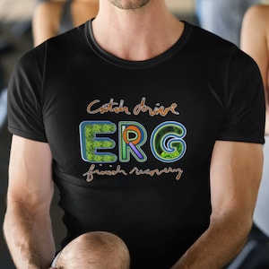May include: A black t-shirt with a colorful graphic design that says "Catch drive ERG finish recovery". The graphic features a green, orange, purple, and blue design with a leafy pattern.