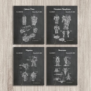 May include: A set of four black and white patent prints featuring the Transformers characters Optimus Prime, Megatron, Starscream, and Devastator. Each print includes the character's name, patent number, and date.