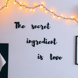 Stylish lettering made of wood - The secret ingredient is love, wall decor