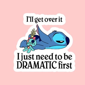 May include: A blue cartoon character with a sad expression lies on its side with a smaller blue character with a stitched mouth. The text reads "I'll get over it I just need to be DRAMATIC first."