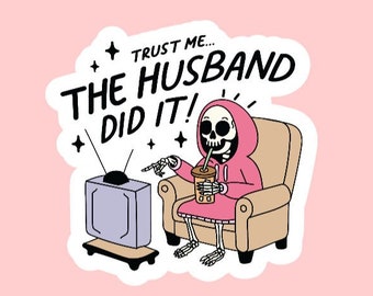 May include: A sticker featuring a cartoon skeleton wearing a pink hoodie, seated in a beige armchair, watching a retro TV. The skeleton holds a drink and points at the TV. Text reads "Trust me... The Husband Did It!" on a pink background.
