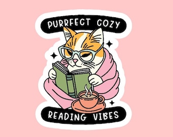 May include: A sticker with a cartoon cat wearing glasses and a pink blanket, reading a book and holding a cup of hot beverage. The sticker says "Purrfect Cozy Reading Vibes".