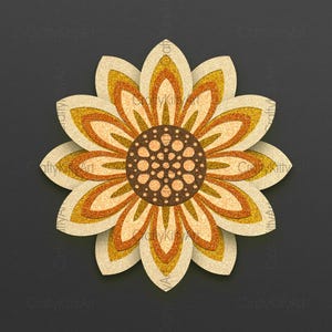 May include: A paper craft sunflower with a brown center and yellow and orange petals. The sunflower is on a dark gray background.