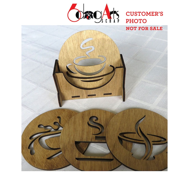 May include: Set of four wooden coasters with a coffee cup design. Each coaster features a different design of a coffee cup with steam rising from it. The coasters are arranged in a square shape with a wooden holder in the center. The holder has a cutout design of a coffee cup with steam rising from it. The text "CUSTOMER'S PHOTO NOT FOR SALE" is visible in the top right corner of the image.
