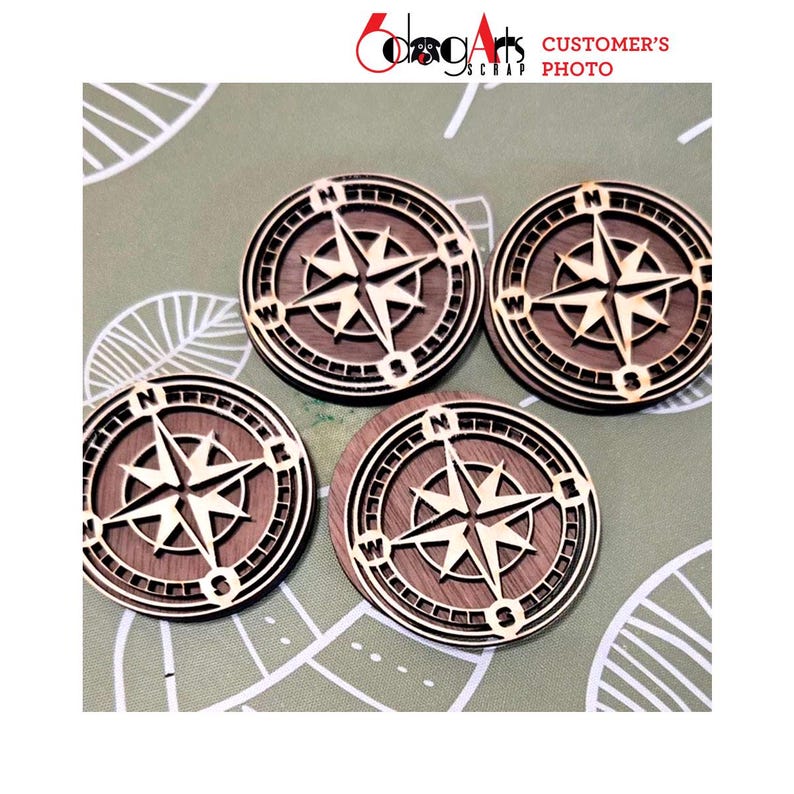 May include: Four wooden compass coasters with a brown wood grain finish and a laser-cut compass design. The compass design features a star with four points and the letters N, S, E, and W.