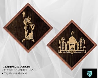 May include: Two wooden art signs featuring laser-cut designs of the Statue of Liberty and the Taj Mahal. The signs are set against a dark wood grain background within a diamond-shaped frame. The text "Landmark Art Signs" is at the top.