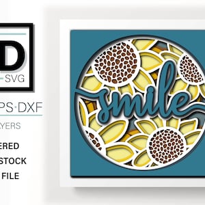 May include: A layered papercraft design featuring a circle of sunflowers with the word "smile" in a white script font. The design is on a blue background and is ready to be cut out and assembled.