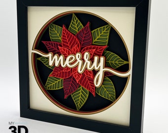 Pode incluir: Uma imagem emoldurada em preto com fundo branco e um recorte de papel 3D de uma flor de poinsettia com folhas verdes e a palavra "merry" em escrita branca.