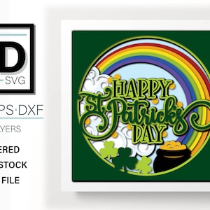 May include: A layered papercraft design featuring a rainbow, clouds, shamrocks, and the text "HAPPY St. Patrick's DAY".