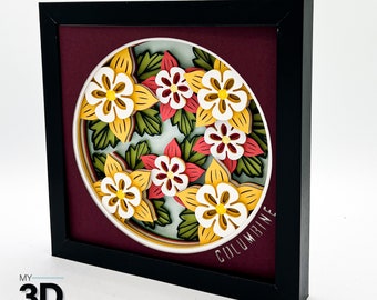 Könnte beinhalten: Ein gerahmtes 3D-Papierkunstwerk mit einem kreisförmigen Design aus gelben, weißen und roten Blumen mit grünen Blättern. Der Text "COLUMBINE" ist in einer geschwungenen Schrift am unteren Rand des Designs geschrieben.
