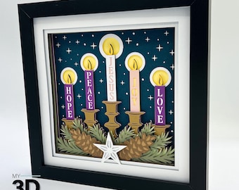 May include: A framed papercraft of five candles with the words "Hope", "Peace", "Jesus", "Joy", and "Love" on them. The candles are set against a dark blue background with white stars.