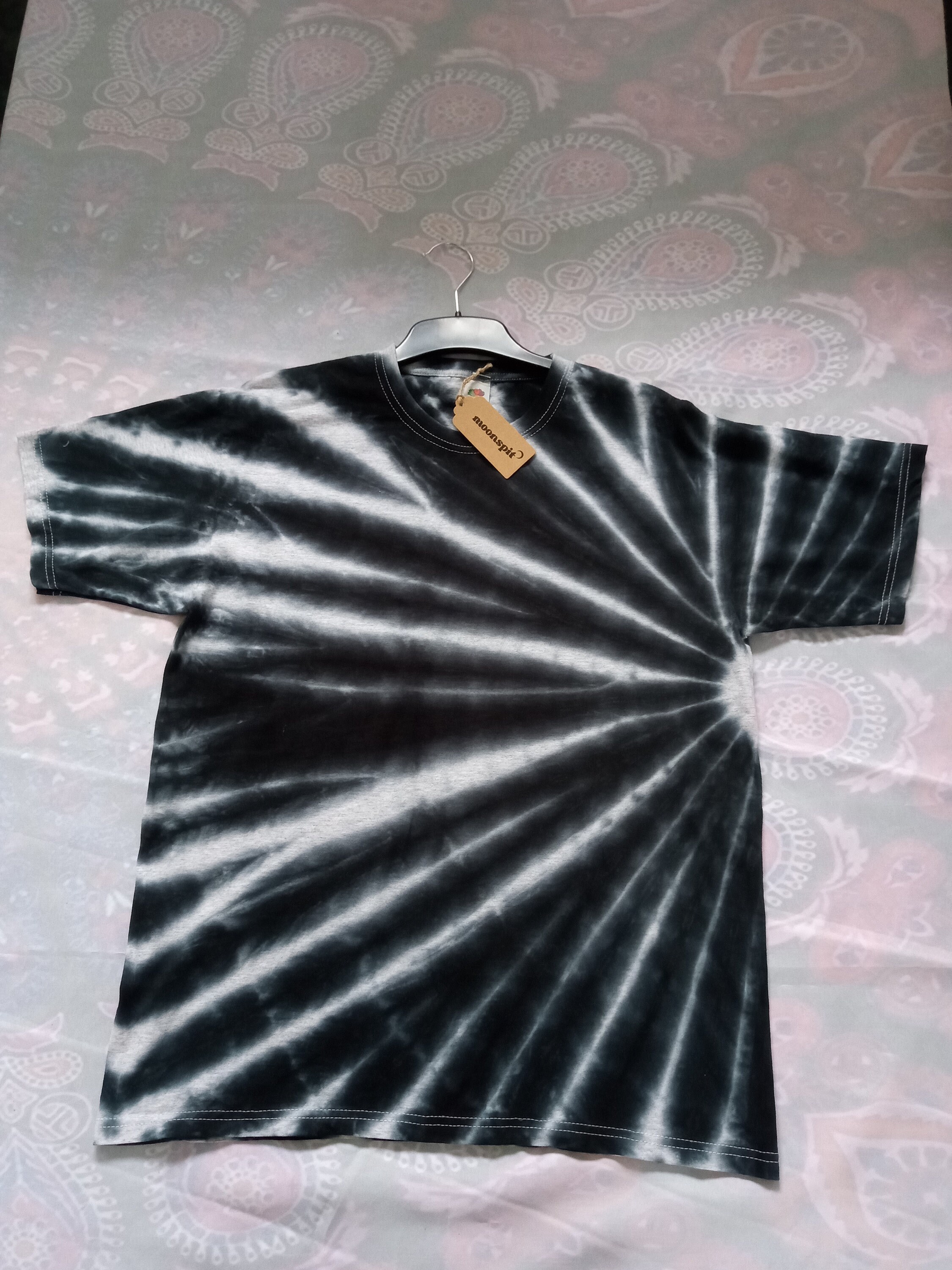 black tie dye on grey shirt