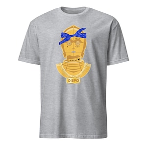 May include: A grey t-shirt with a gold robot wearing a blue bandana and a gold chain with a pendant that says "G-3PO".
