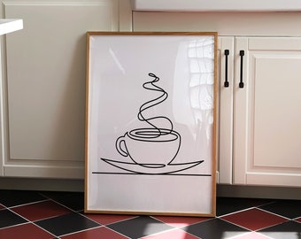 May include: A framed black and white line drawing of a coffee cup with steam rising from it. The drawing is on a white background and is framed in a light wood frame.