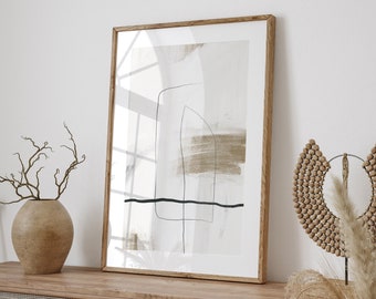 May include: A framed abstract art print with brown and black lines on a white background. The print is hanging on a white wall above a wooden dresser with woven rattan doors. A wooden beaded sculpture and dried grasses are on the dresser.