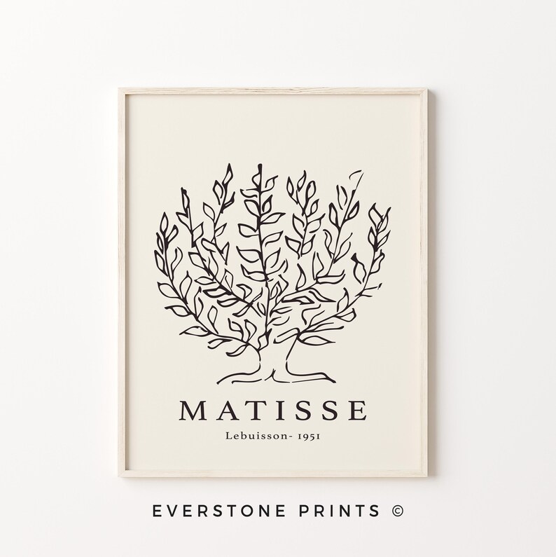 May include: Black and white line art print of a tree with the text "MATISSE Lebuisson - 1951" below the image. The print is framed in a light wood frame.