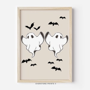 May include: A printable art print featuring two white ghosts with black eyes and a beige background.  There are multiple black bats flying around the ghosts.  The text "EVERSTONE PRINTS &copy;" is at the bottom of the print.