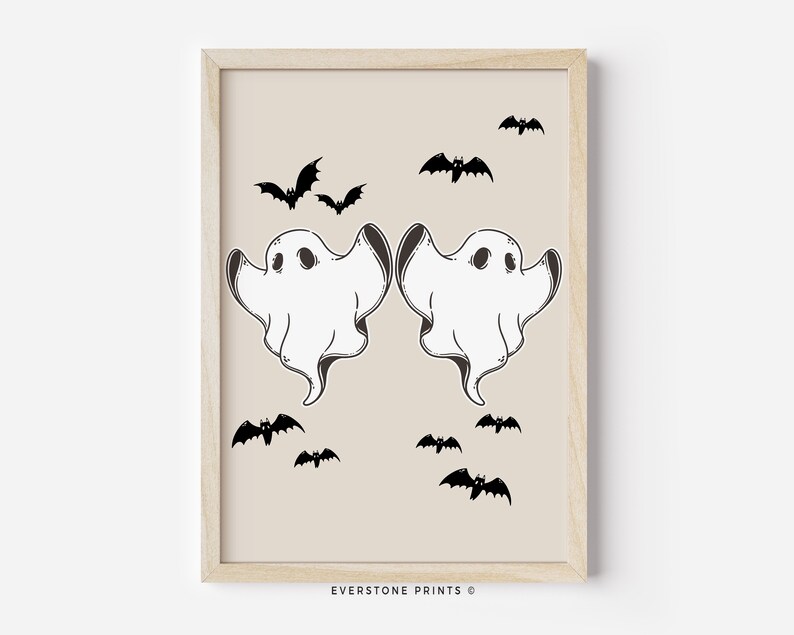 May include: A printable art print featuring two white ghosts with black eyes and a beige background.  There are multiple black bats flying around the ghosts.  The text "EVERSTONE PRINTS &copy;" is at the bottom of the print.