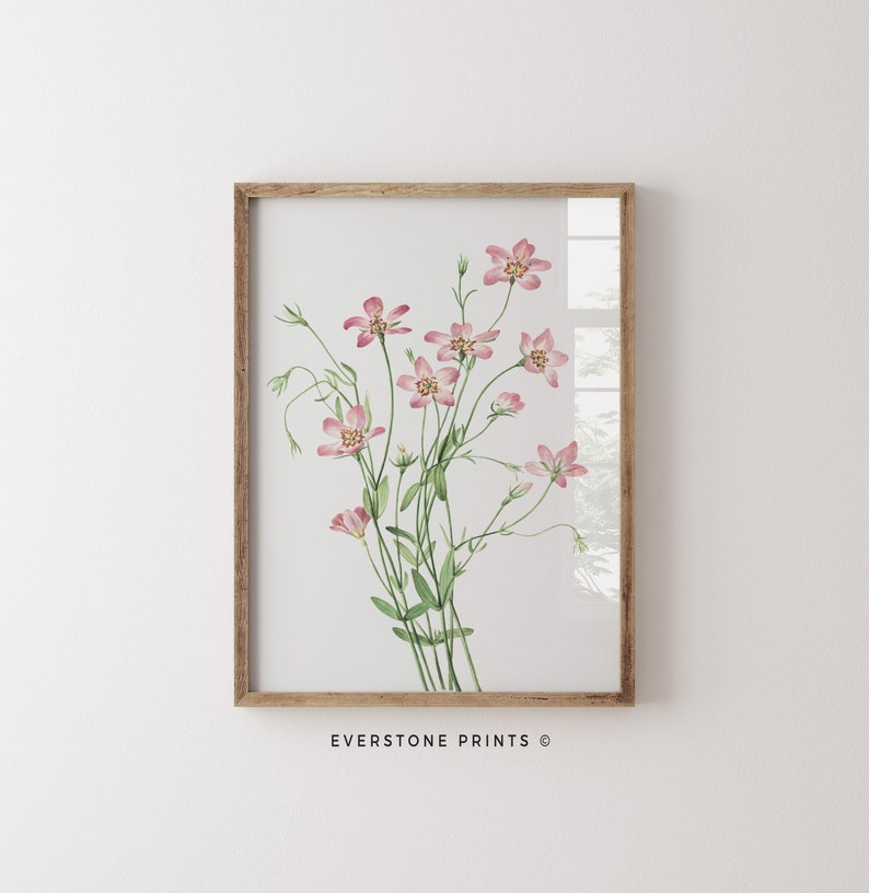 May include: A framed watercolor print of a bouquet of pink flowers with green stems and leaves. The print has a white background and is framed in a light brown wood frame. The text "EVERSTONE PRINTS &copy;" is printed below the image.