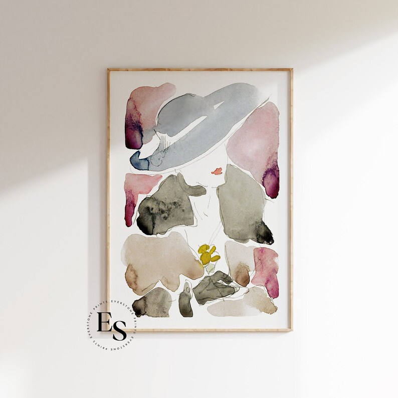 May include: Abstract watercolour painting of a woman wearing a hat. The painting is in shades of pink, blue, grey, and brown. The woman's face is partially obscured by the hat.