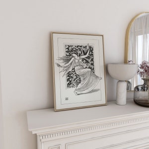 May include: A black and white framed print of a woman dancing in a flowing dress. The woman is surrounded by a floral design. The print is on a white shelf with a white mantle.