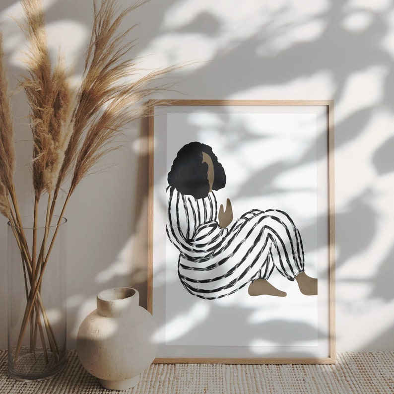 May include: A black and white striped illustration of a person sitting with their legs crossed. The person has dark hair and is wearing a striped jumpsuit.