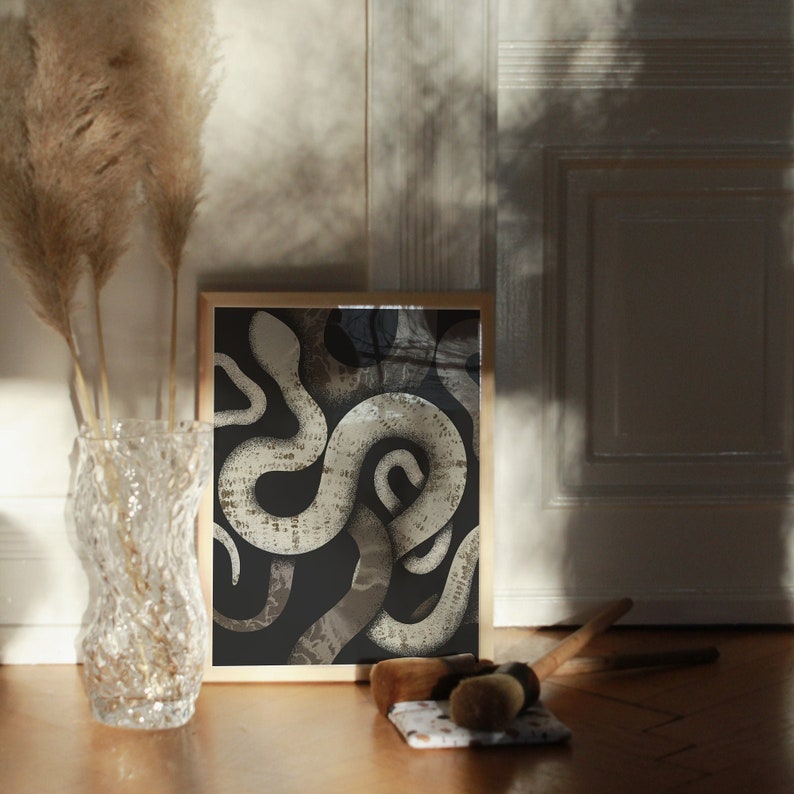 May include: A framed print of a black and white illustration of a snake coiled in a complex pattern.