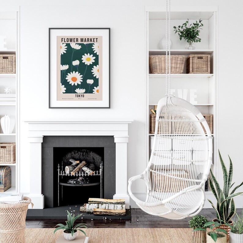 May include: A white wicker hanging chair with a black and white poster above it. The poster features a floral design with the text "FLOWER MARKET TOKYO".