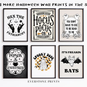 May include: Six framed Halloween-themed prints with black and white illustrations and text. The prints feature designs such as "Hex the Patriarchy", "Hocus Pocus Co.", "You Don't Have to Die to Be Dead to Me", "Poison Unfiltered", "Spooky Dude", and "It's Freakin' Bats".