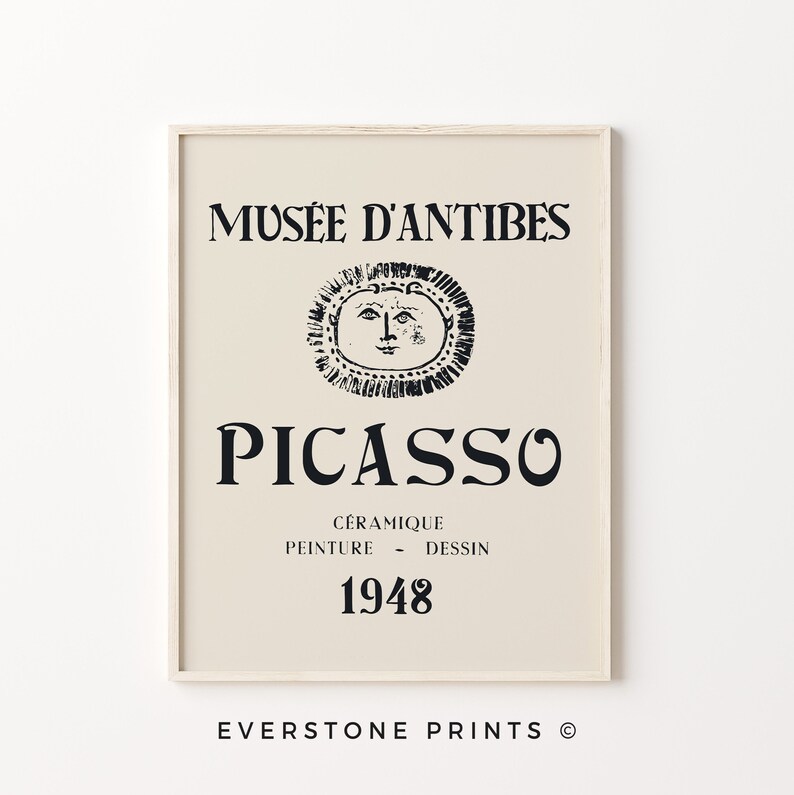 May include: A beige poster with black text that reads "Mus&eacute;e d'Antibes Picasso C&eacute;ramigue Peinture - Dessin 1948" and a black and white illustration of a sun with a face.