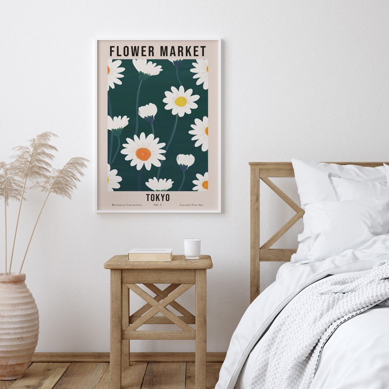 May include: A poster with a floral design featuring white daisies with yellow centers on a dark green background. The poster has the text "FLOWER MARKET TOKYO" at the top and "Botanical Collection No. 1 Gallery Four Art" at the bottom.