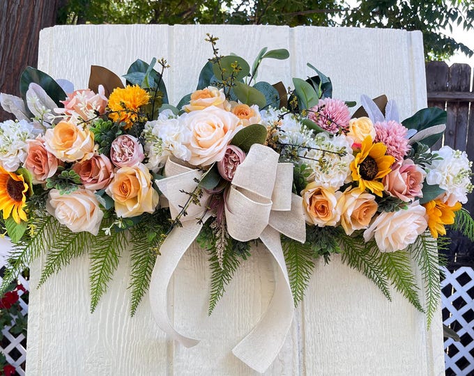 Vintage door swag faux florals in neutral colors of beige white cream.