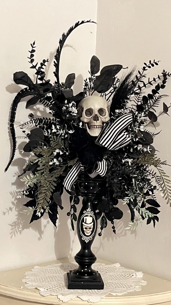 Halloween centerpiece black candle stick skeleton head medium size 27"in high- 16"in wide- 12"in deep.