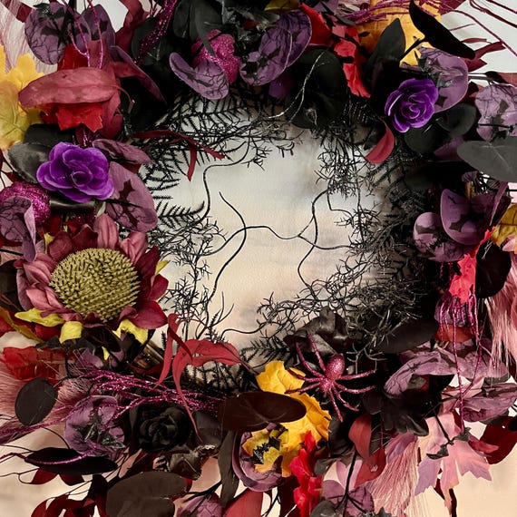 Gothic style Halloween Wreath black/purple pumpkins, spiders, bats. 22"in a round 5"in deep.