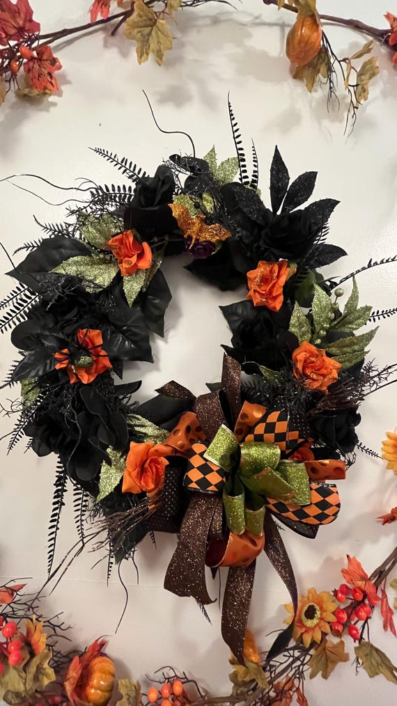 Halloween wreath black and sequence green leaves measures 25"inches round 5"inches deep. Gothic style for everyday or holiday. Handmade.