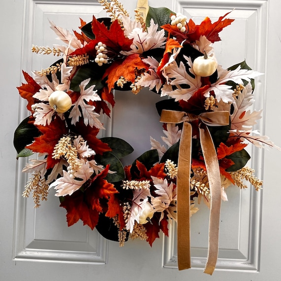 Fall Wreath Autumn colored leaves white pumpkins and magnolia leaves.