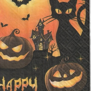 May include: Halloween-themed napkin featuring a black cat, jack-o'-lanterns, bats, and a witch flying across a full moon. The words "Happy Halloween" are printed in orange. The background is orange and black.