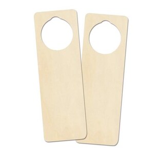 May include: Two unfinished wooden door hangers. Each is rectangular with a rounded top and a circular cutout for the doorknob. The wood has a light, natural colour.