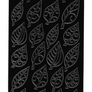 May include: Sheet of peel-off stickers with a repeating pattern of detailed leaf designs. The leaves have a silver outline and intricate interior patterns, set against a black background. The product is from Elizabeth Craft Designs.