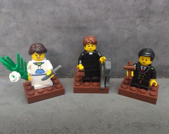 3 Saints in Lego (St. Maria Goretti,  St. John Bosco, St. Dominic Savio.)