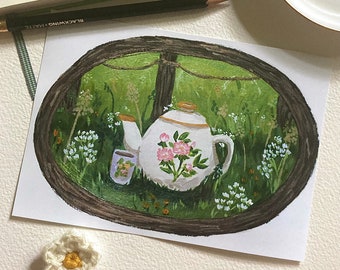 May include: A watercolor painting of a white teapot with pink flowers and a cup of tea in a green field. The teapot and cup are surrounded by green foliage and white flowers.