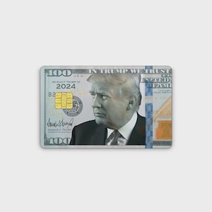 May include: A rectangular credit card featuring a portrait of Donald Trump in a suit and tie. The design incorporates elements of a one hundred dollar bill, including the text RE-ELECT TRUMP IN 2024, a gold EMV chip, and a blue security strip.