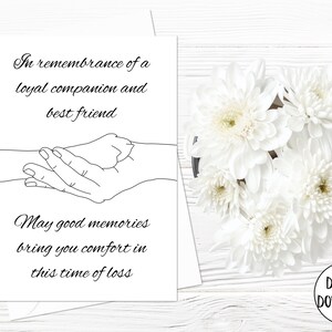 May include: Black and white line art illustration of a human hand holding a paw print. The text reads "In remembrance of a loyal companion and best friend. May good memories bring you comfort in this time of loss."