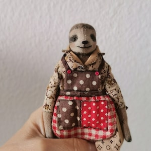 Textile doll sloth in rustic vintage style on a stand, interior toy, gift to a woman. OOAK