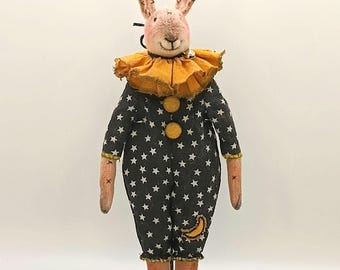 Bunny teddy doll on a stand. A small interior toy in a vintage style.