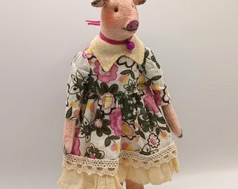 Pig, textile art doll in a romantic dress, interior miniature on a stand