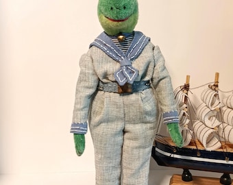 Frog Sailor, a vintage-style textile interior doll on a stand.